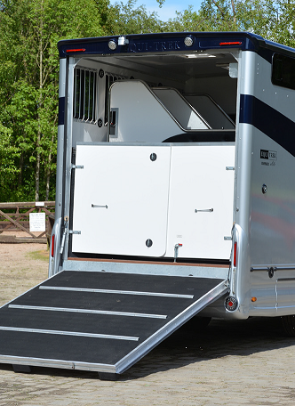 A horse trailer with the door lowered