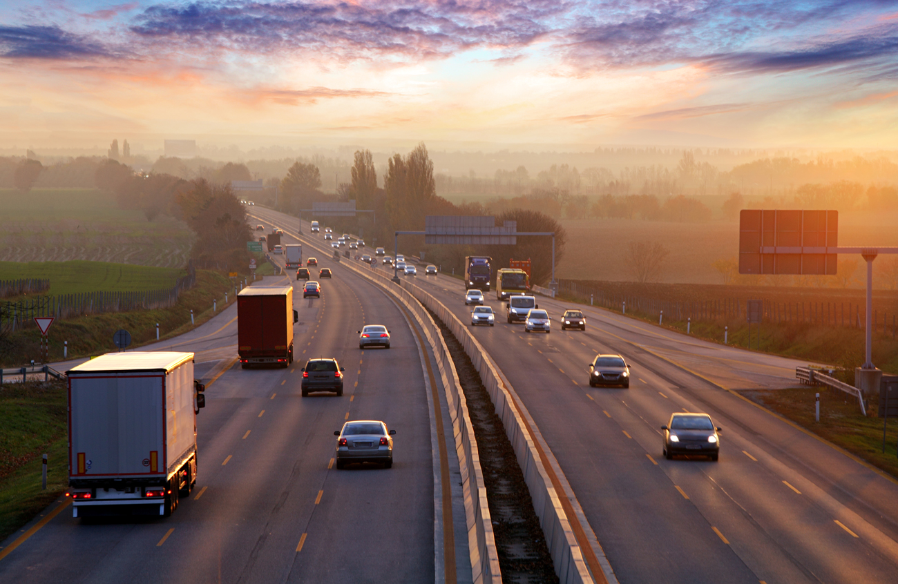 A busy motorway at sunset